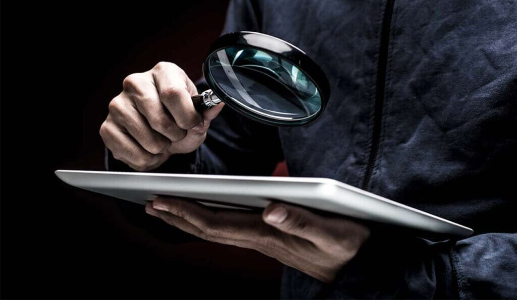 a magnifying glass held over documents suggesting close examination of evidence